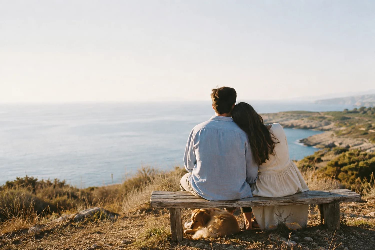 A man and woman sharing a quiet moment by the sea